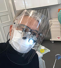 Dentist Dr. Peter Seehofer with a protective mask in Munich
